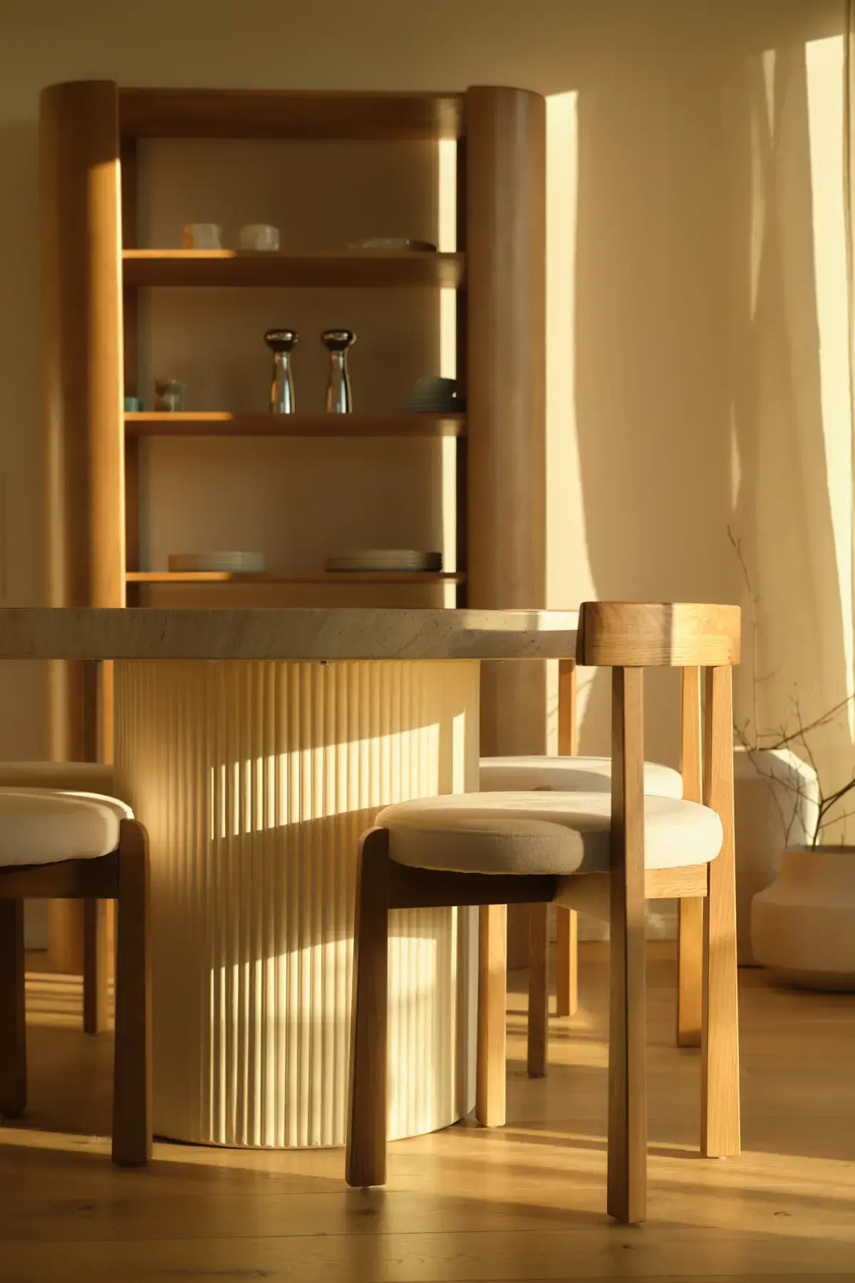 The Ask oak dining table with chairs in a sunlit dining room
