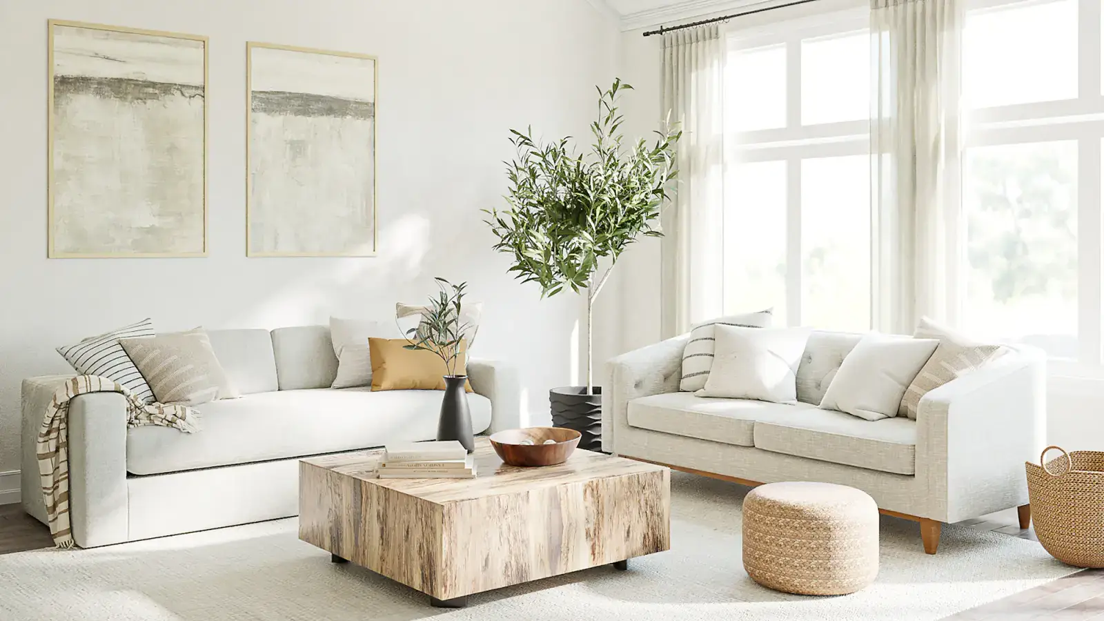 A bright living room with a pale oatmeal sofa on oak legs, a solid-wood coffee table and an olive tree by the window