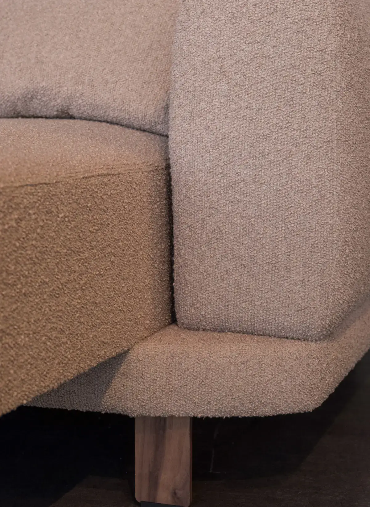 Close-up of the Lund sofa in oatmeal bouclé on oiled oak legs