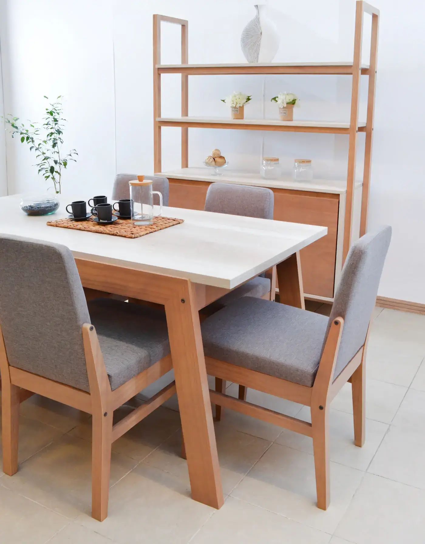 A modern dining room with a long wooden table and matching chairs