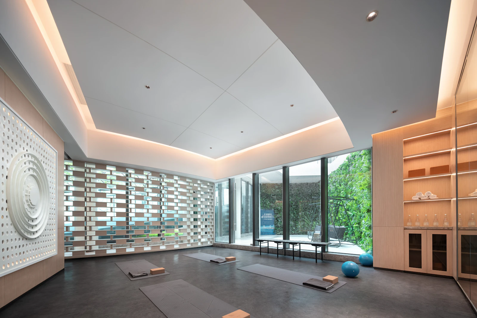 A bright, quiet yoga studio with big windows